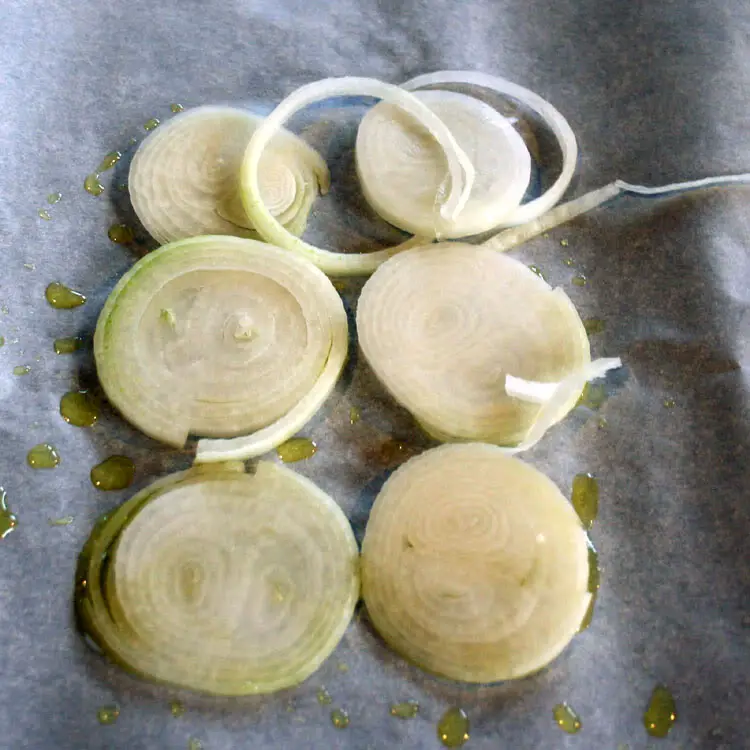 onions as a base for chilean sea bass en papillote