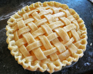 finish edges, brush with egg wash and dust with sugar for classic peach pie