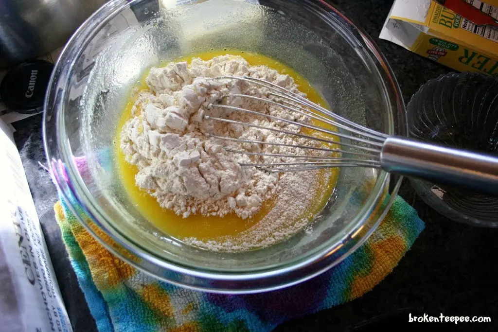 add flour to eggs, butter and sugar in bowl