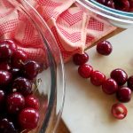 cherries in a bowl and being pitted