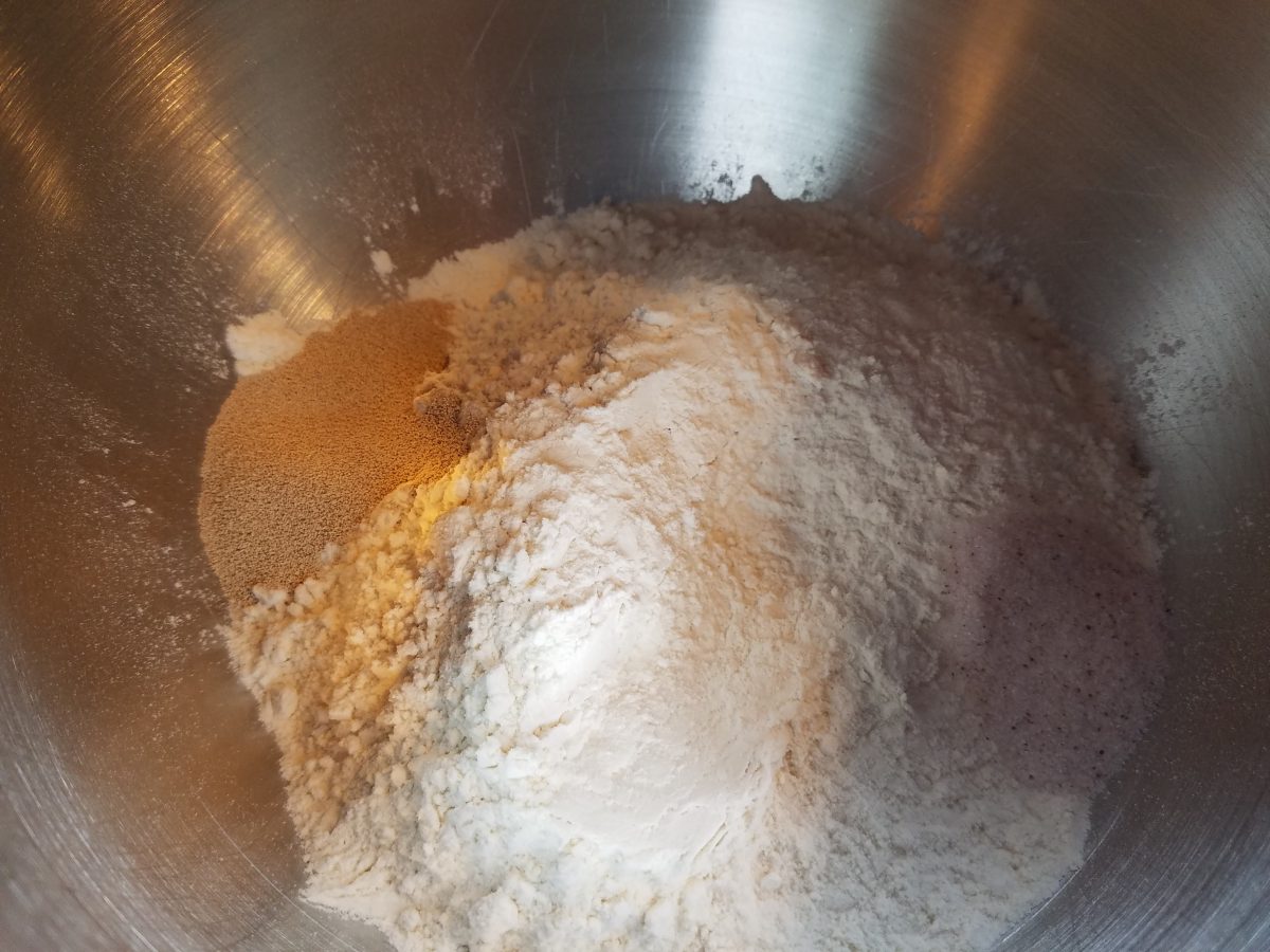 ingredients for homemade ciabatta bread in bowl of stand mixer