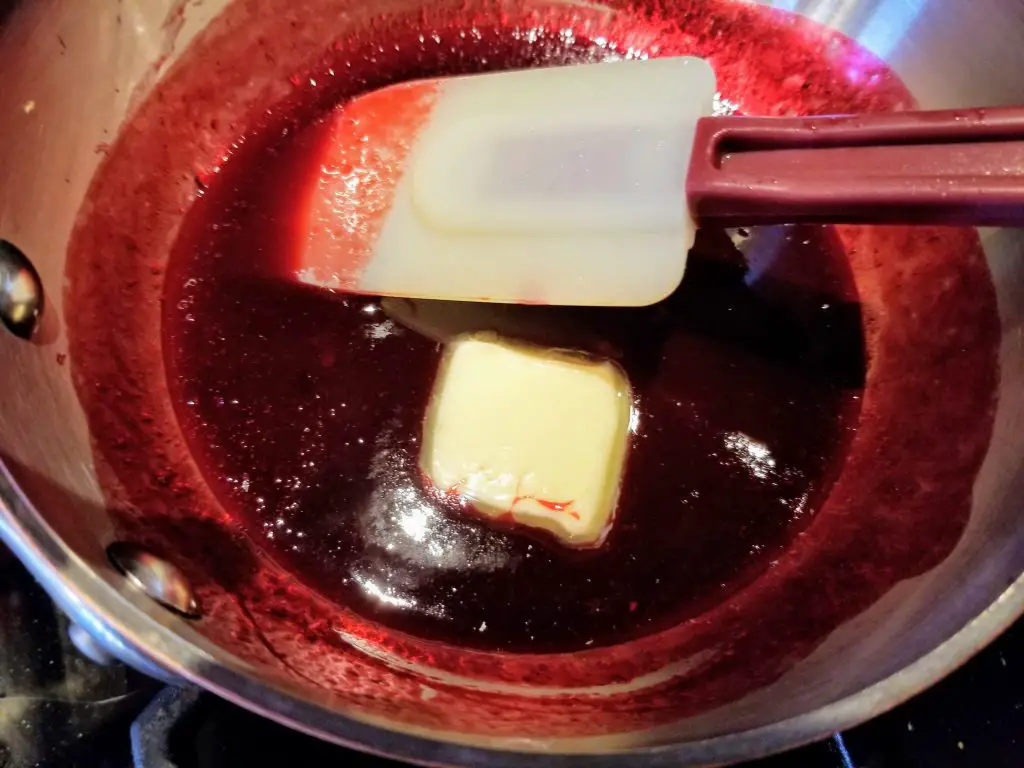 add cold butter to blackberry sauce