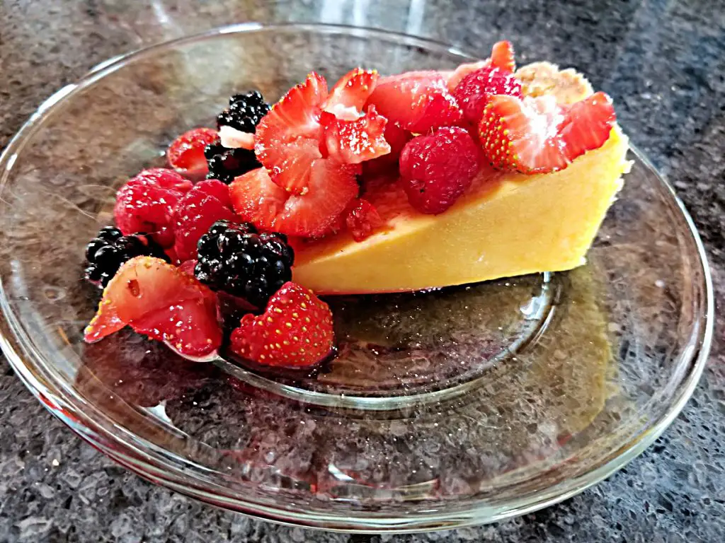 slice of cheesecake with honey lemon berries