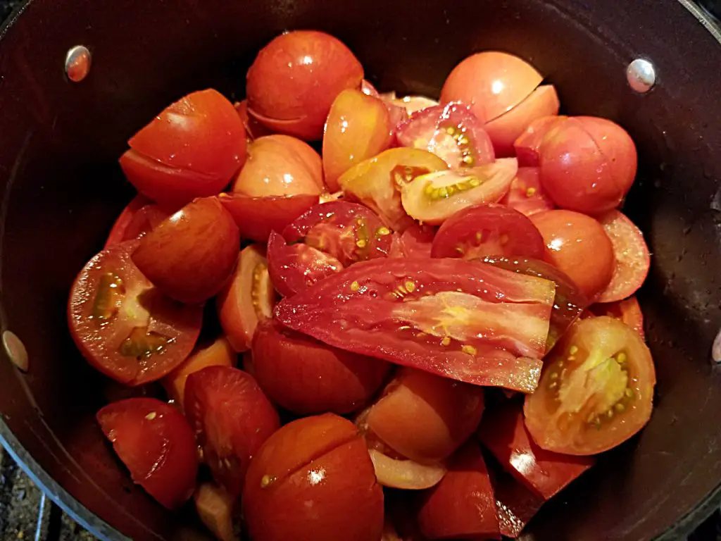 add tomato chunks to pot