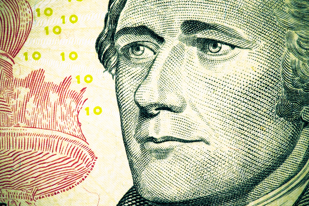 Close up to Alexander Hamilton portrait on ten dollar bill. Tone