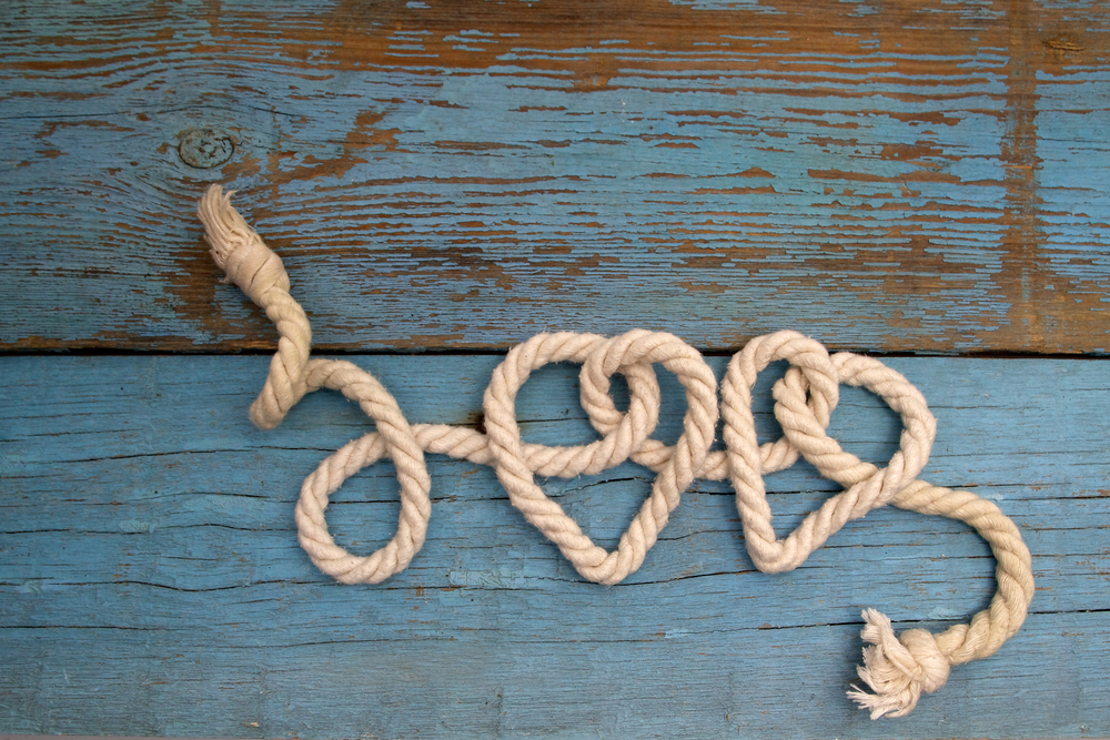 leash rope into heart shape on wood