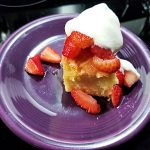 yellow cake with whipped cream and strawberries