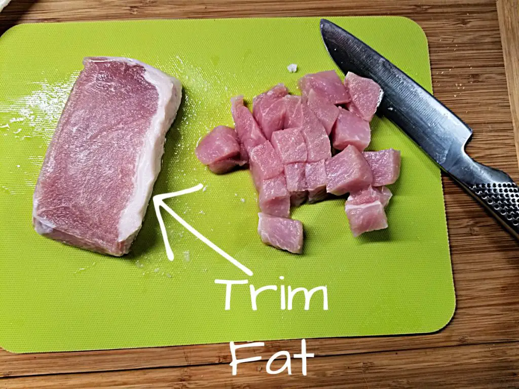 trim fat and cut up pork