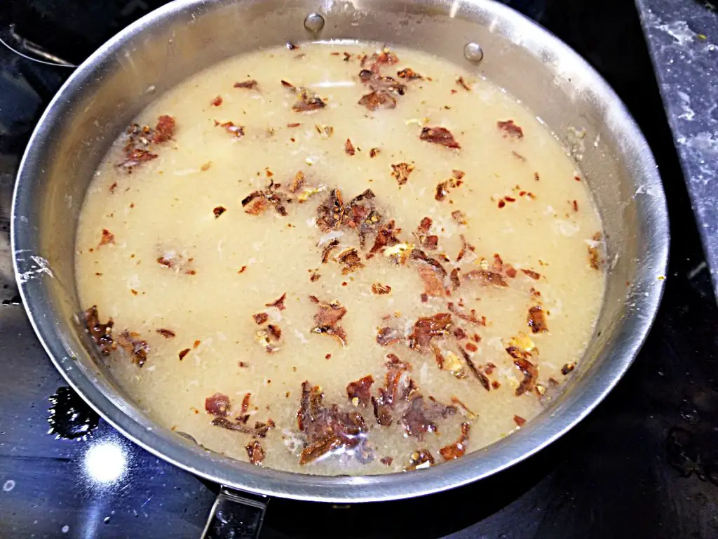 stir in white wine, chicken broth and add dried tomatoes